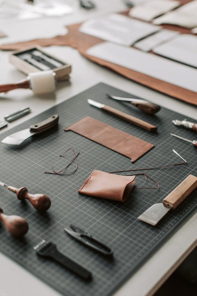 Tools and Leather Lying on a Desk in a Leather Crafting Workshop